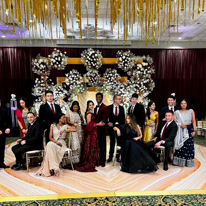 wedding party in front of extravagant stage
