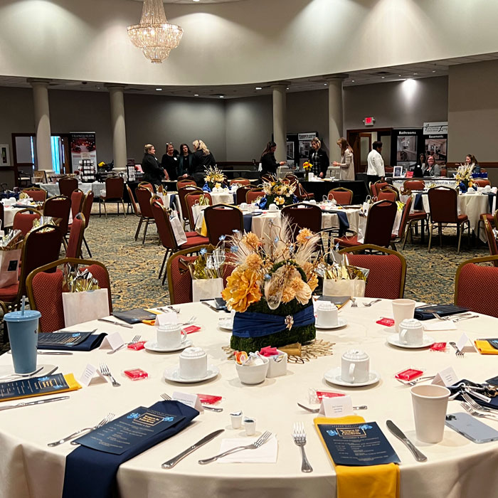 decorated tables setup for corporate event in ballroom